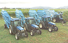 Part of the Montana vineyard New Holland TNF fleet, with gondola attachments prepared for the 2002 harvest.